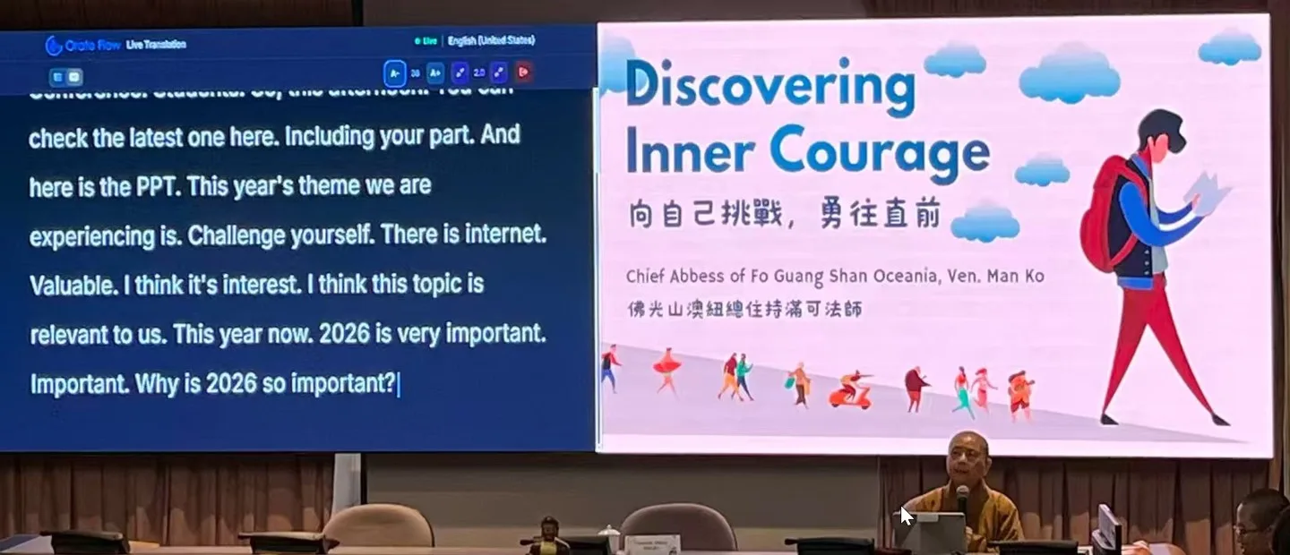 A remote teacher on the projection screen beside Orato Flow’s live captions, with a congregation following in the hall.